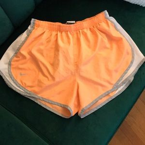 Bright orange Nike Dri-fit shorts (Large)